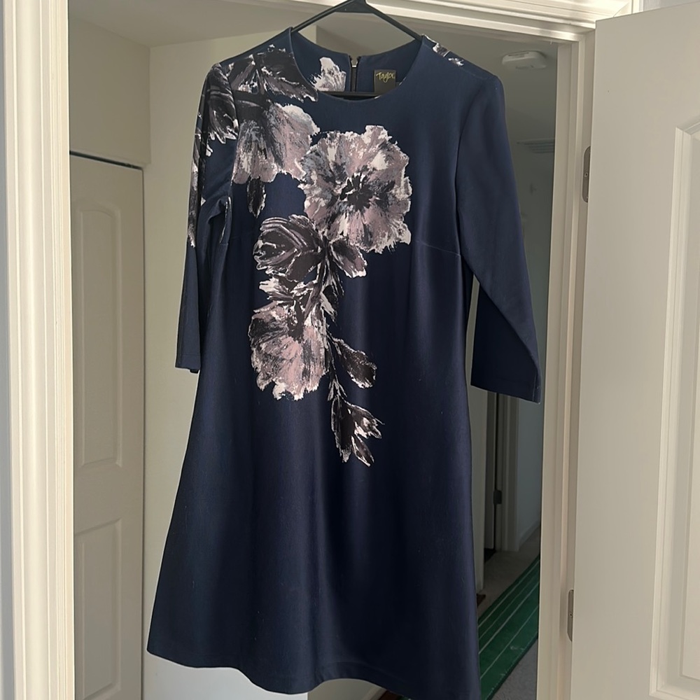 Navy a line dress, three quarter sleeve with gray florals.